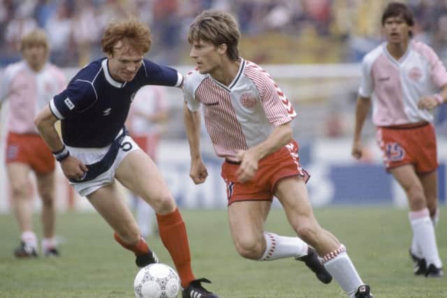 Alex McLeish tries to stop Denmark striker Michael Laudrup during Scotland's opening game of the 1986 World Cup in Mexico