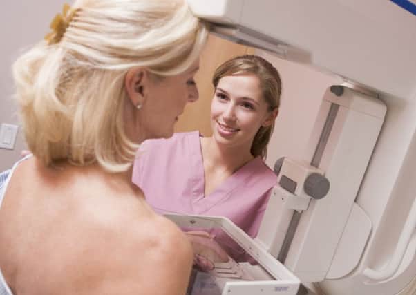 Photo of a woman taking part in breast cancer screening, Picture: PA