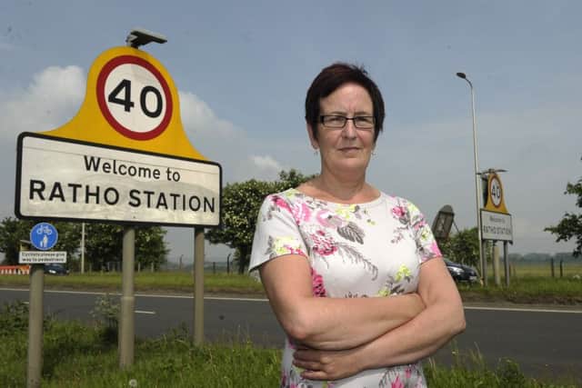 Fiona Hoy beside the speed limit signs. Picture: Neil Hanna