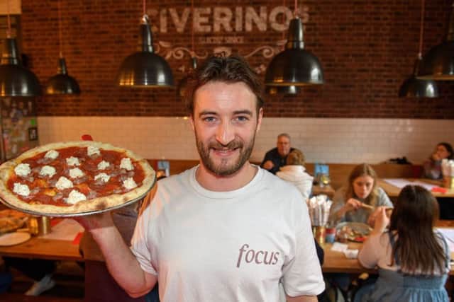 Manager Cree Britee-Steer with one of Civerinos' pizzas. Picture: Ian Georgeson
