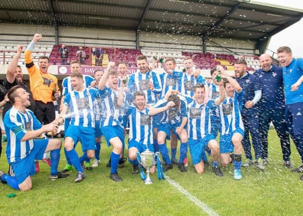 Penicuik celebrate winning the East of Scotland Cup in their final match as a Junior club. Pic: Ian Georgeson