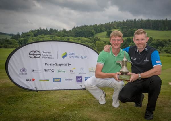 Stephen Gallacher presents the Foundation trophy to winner Connor Wilson (Castle Park GC) at Cardrona Golf Club after his win. 
Pic: Kenny Smith