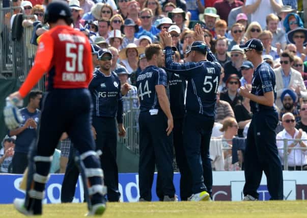 Scotland players celebrate taking the the wicket of Jonny Bairstow