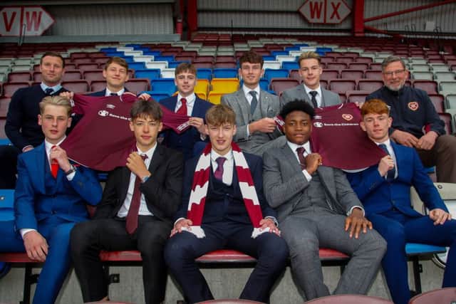 Back row, from left: Hearts youth coach Andy Kirk, Cameron Logan, Mackenzie Lawler, Dino Leddie, Josh Grigor and manager Craig Levein. Front, from left: Scott McGill, Aaron Hickey, Broadie Strang, Leeroy Makovora and Sean Ward. Pic: Scott Louden