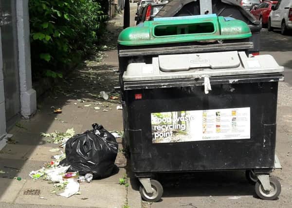 Rubbish dumped next to communal bins on Wishaw Terrace