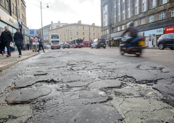 The poor quality of Edinburghs existing road surfaces is a problem for drivers, cyclists and pedestrians. Picture: Ian Georgeson