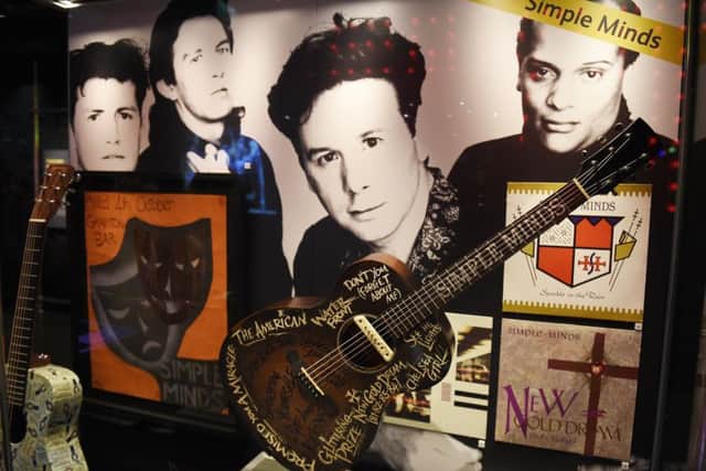 Rip It Up exhibition at the National Museum Scotland celebrating Scottish Pop Music through the years - Simple Minds guitar