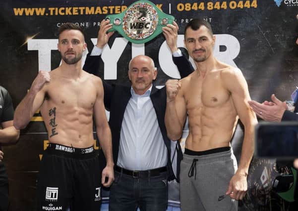 Josh Taylor, left, and Viktor Postol flank Barry McGuigan during the weight in for their fight in Glasgow tonight. Pic: SNS