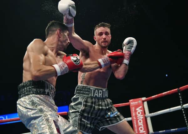Josh Taylor goes on the offensive against Viktor Postol. Picture: SNS Group