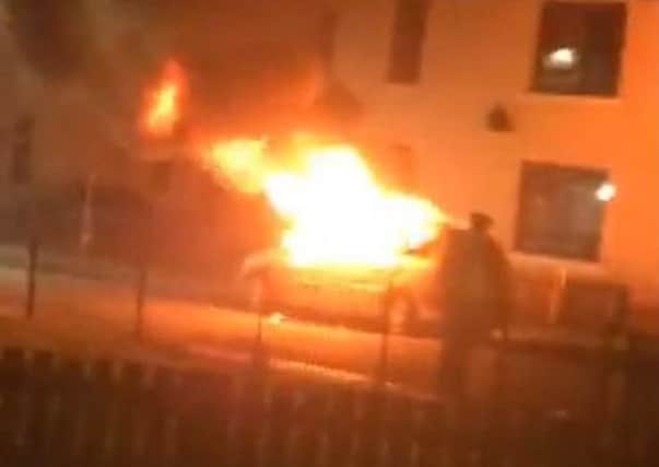 A car on fire near Mayfield drive. Picture: Video Still/Facebook