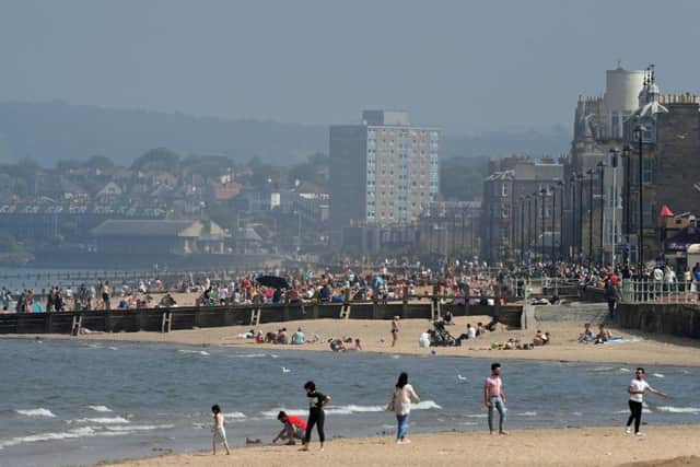 People enjoy the sunshine on Portobello beach, Edinburgh, as the hot weather continues to sweep across the country. Picture; PA