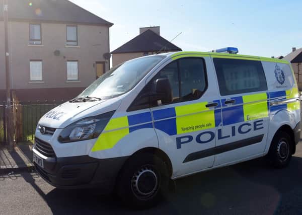 A police van parked outside the Mayfield Drive house