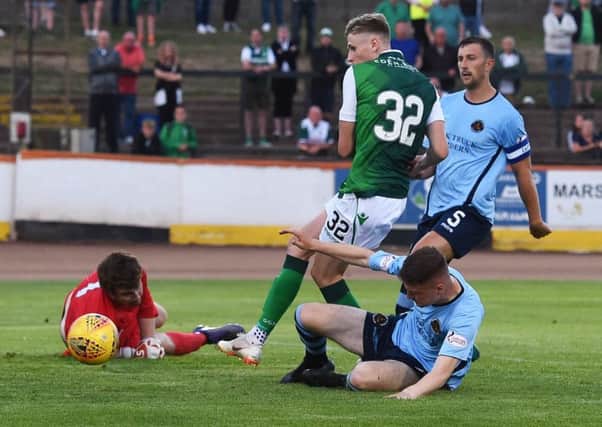 Oli Shaw scores his second - and Hibs' fifth - goal against Berwick