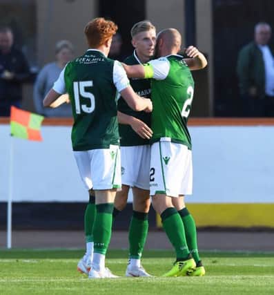 Hibs' Oli Shaw (centre) celebrates his opening goal against Berwick with team-mates David Gray and Simon Murray. Pic: SNS
