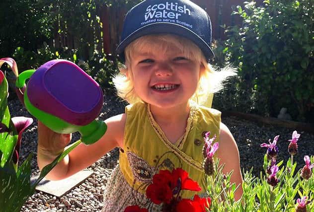 Marcy Walker, aged 3, has fun in the sun in her Edinburgh garden. Picture: Scottish Water