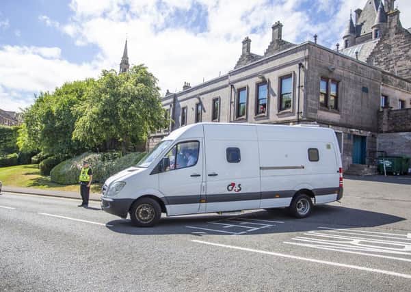 A G4S Van leaves Greenock Sheriff Court carrying a 16 year-old boy who has been arrested and charged in connection with the death of six year-old Alesha MacPhail. Picture; SWNS