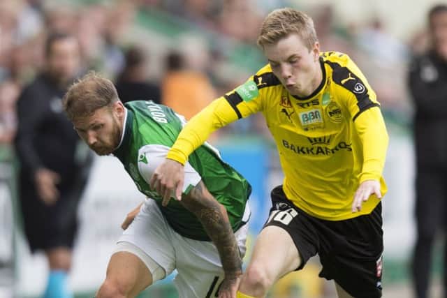 Martin Boyle battles with NSI Runavik's Petur Knudsen