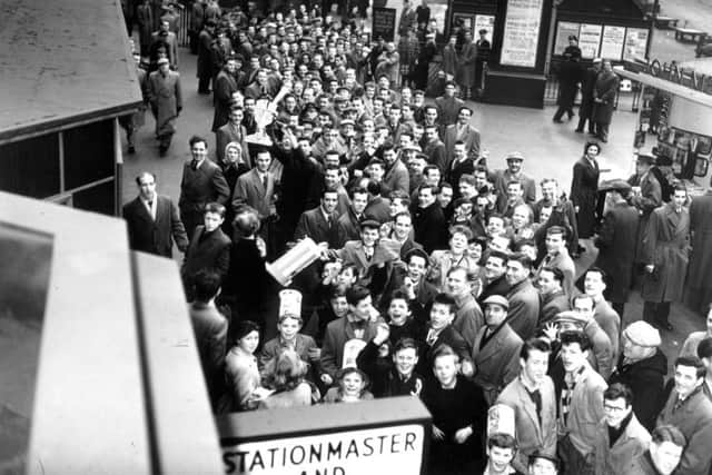 Hibs fans queue at Edinburgh's Princes Street station (aka Caley station/Caledonian station) for the special train to Glasgow in March 1959. It was to end in disappointment though as the Scottish cup tie ended in a 2-1 win for Third Lanark.