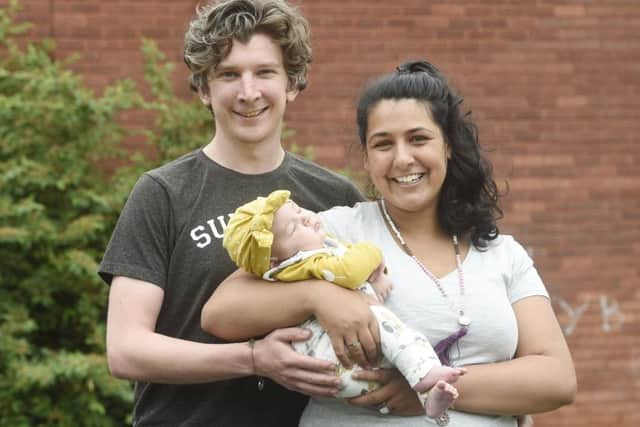 Matthew and Stephanie Faulds with 10 week old Jasmina. They are crowd funding a zero waste shop.
