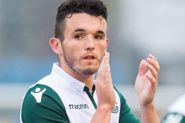 John McGinn salutes the travelling fans at the Svangaskard Stadium