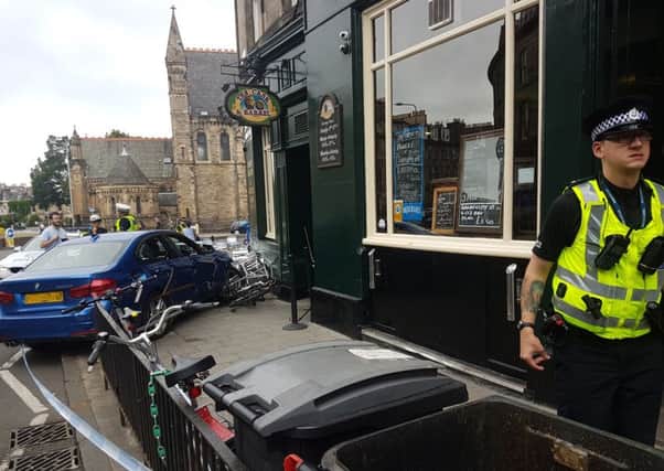 The car ploughed into the outside seating area for the Cask & Barrel pub in Broughton Street. Picture: TSPL