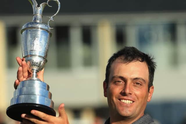 Francesco Molinari holds aloft the Claret Jug after seeing off his rivals