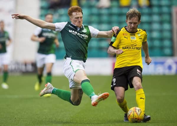 Simon Murray closes down Runavik's Bardur Hansen in the Europa League First Qualifying Round first leg tie at Easter Road. Picture: SNS Group