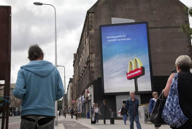 A giant digital billboard on Leith Walk