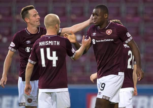 Uche Ikpeazu is congratulated on scoring his first goal for Hearts