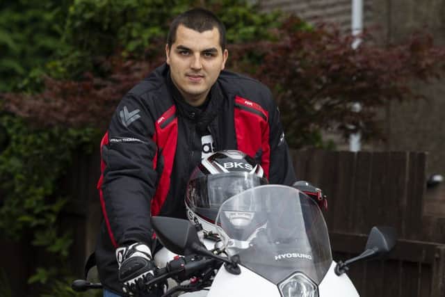 Daniel Sradzinski who lost his left arm in a battle against cancer is now learning to ride a motorbike one handed. Picture: SWNS