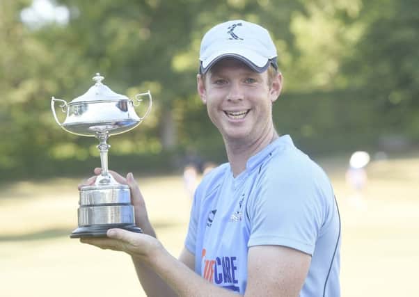 Ali Evans shows off the Masterton Trophy after they overcame RH Corstorphine at Grange Loan. Pic: TSPL