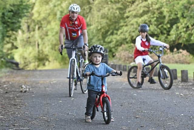 Organiser George Stewart rides the course before the big day with Noah White (almost 2)  and Ellie Gordon (9). Picture: Neil Hanna