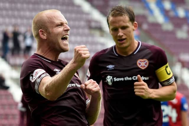 Steven Naismith celebrates scoring his second and Hearts' fifth goal