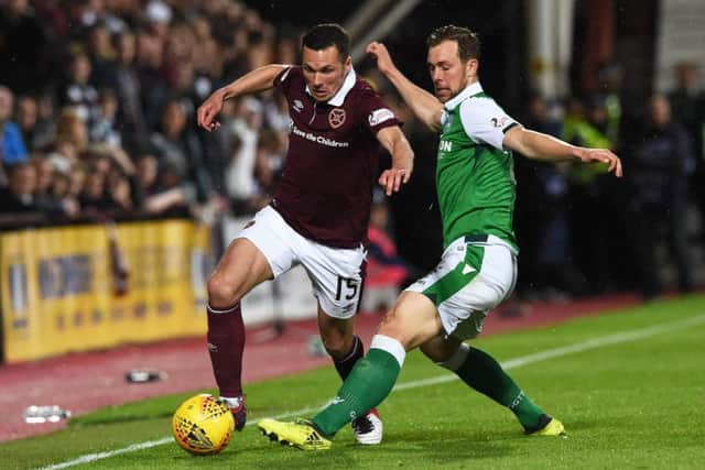 Don Cowie in action for Hearts against Hibs. The midfielder has been told he is free to leave the club. Picture: SNS Group