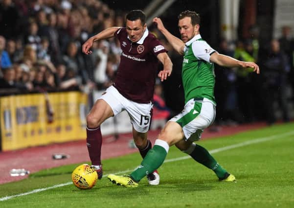 Don Cowie in action for Hearts against Hibs. The midfielder has been told he is free to leave the club. Picture: SNS Group
