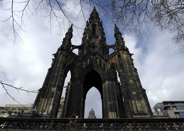 The prankster clambered up the Scott Monument and brought Princes Street to a standstill. Picture: Neil Hanna