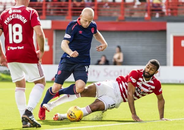 Steven Naismith is brought down in the box by Hamilton's Alex penny.