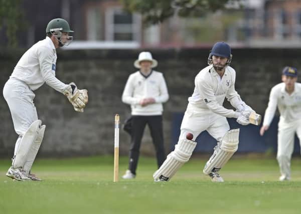 Grange star Dylan Budge hits out as Sam Flett keeps wicket for Corstorphine. Pic: Neil Hanna