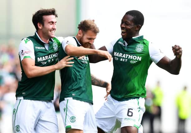 Stevie Mallan and Marvin Bartley celebrate with Martin Boyle (centre). Picture: SNS
