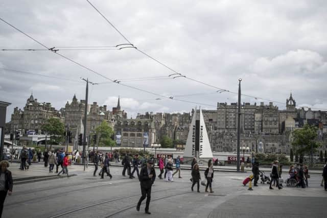 Pedestrian enjoy traffic free space as trams are given priority over other vehicle traffic. Picture; Steven Scott Taylor.