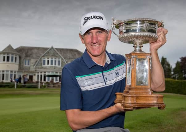 Euan McIntosh, who beat 18-year-old Jamie Stewart at Blairgowrie, shows off the magnificent trophy. Pic: Kenny Smith
