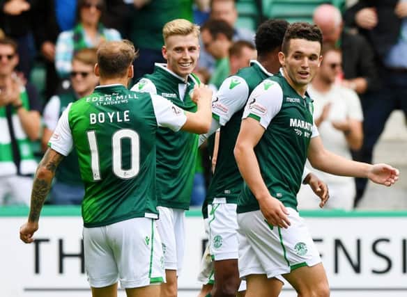 Oli Shaw celebrates with his Hibs team-mates. Picture: SNS
