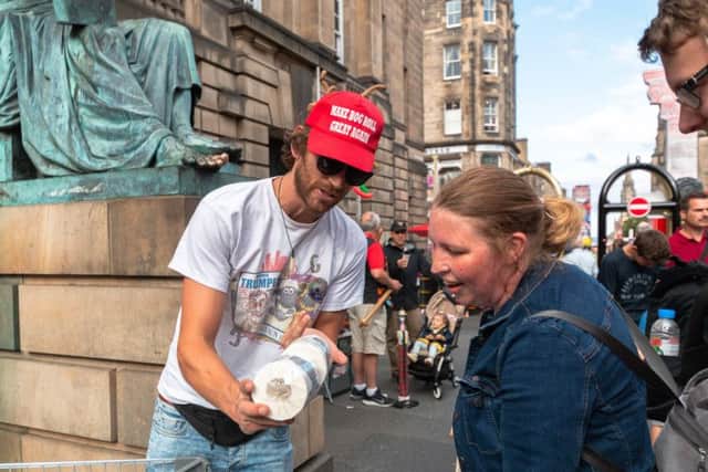 The boss of a marketing firm says he makes more money selling loo roll with Donald's Trump face printed on it to punters at the Edinburgh Fringe Festival than from his job. Picture; SWNS
