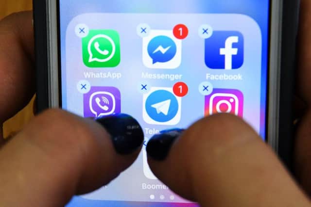 Ofcom says 20 per cent of Britons spend as much as 40 hours a week on their smartphones. Picture: Getty