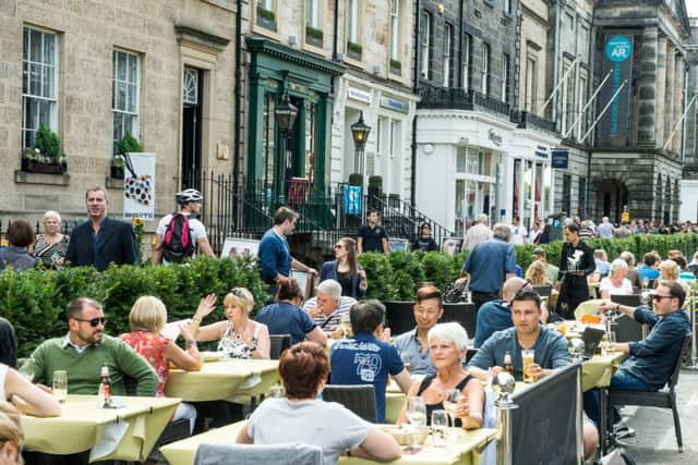 Al fresco dining during the Festival in the middle of George Street could become an all-year round sight if the thoroughfare is pedestrianised. Picture: Ian Georgeson