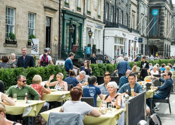 Al fresco dining during the Festival in the middle of George Street could become an all-year round sight if the thoroughfare is pedestrianised. Picture: Ian Georgeson