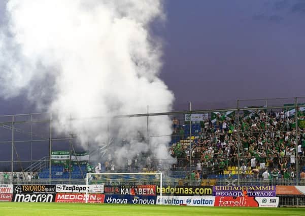 Hibs fans set off flares at the Theodoros Kolokotronis Stadium, incurring UEFA's wrath. Picture: SNS Group