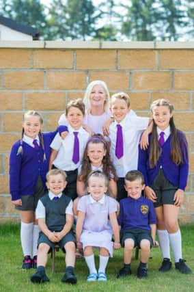 Gran Christine Brocklehurst with Grad children Scarlett 11, Zara 9, Jack 8, Ava 7, Ethan 7, Savanna 6, Christopher 5, Kenneth 4 who are all at the same school