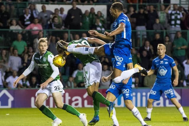 Emerson Hyndman goes close with a header as Hibs drew with Molde. Pic: SNS