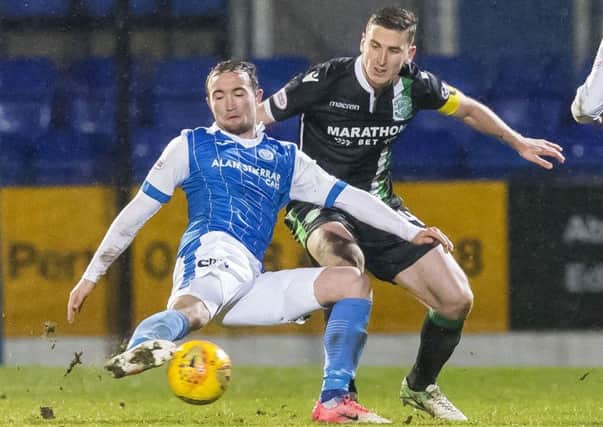 Paul Hanlon and Chris Kane compete for the ball during the last encounter between the sides at McDiarmid Park. Picture: SNS Group